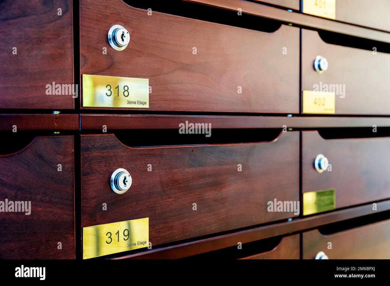 Wooden Mailboxes in the entrance hall of a residential house Stock Photo