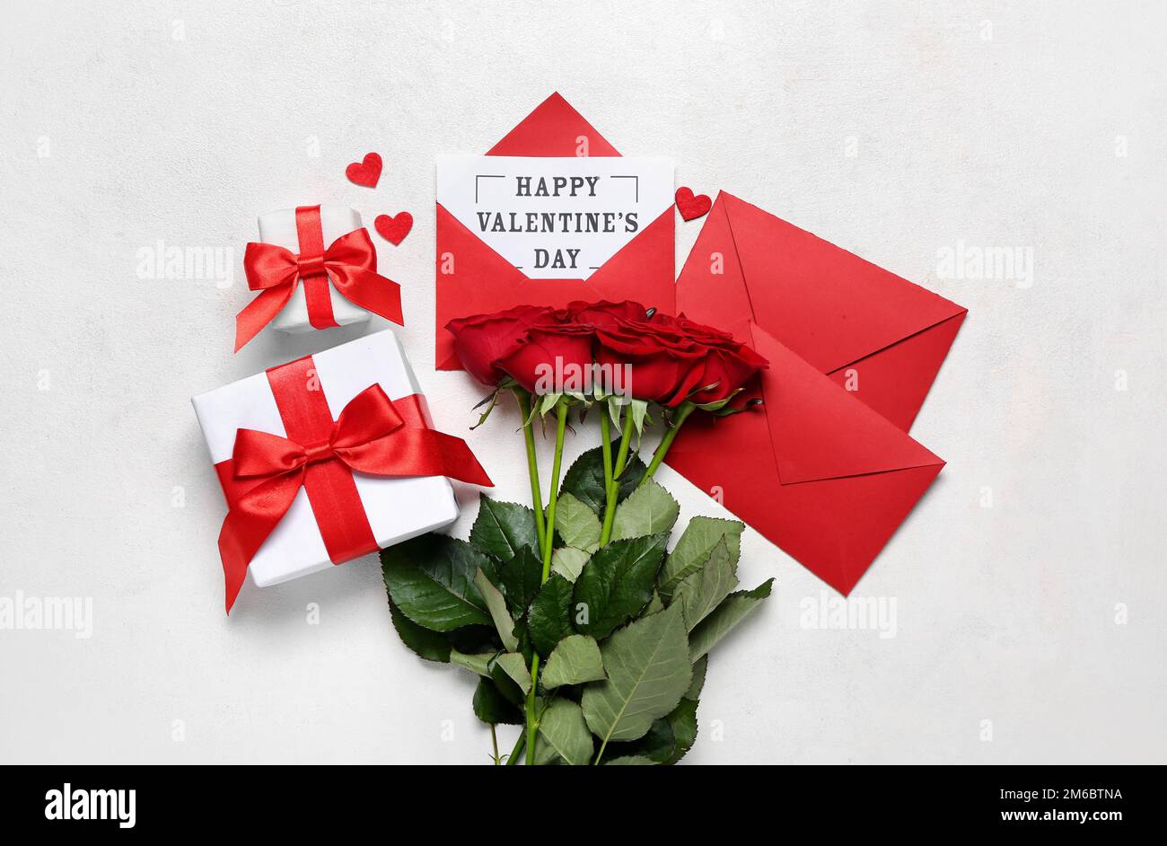Card with text HAPPY VALENTINE'S DAY, roses, envelopes and gifts on ...