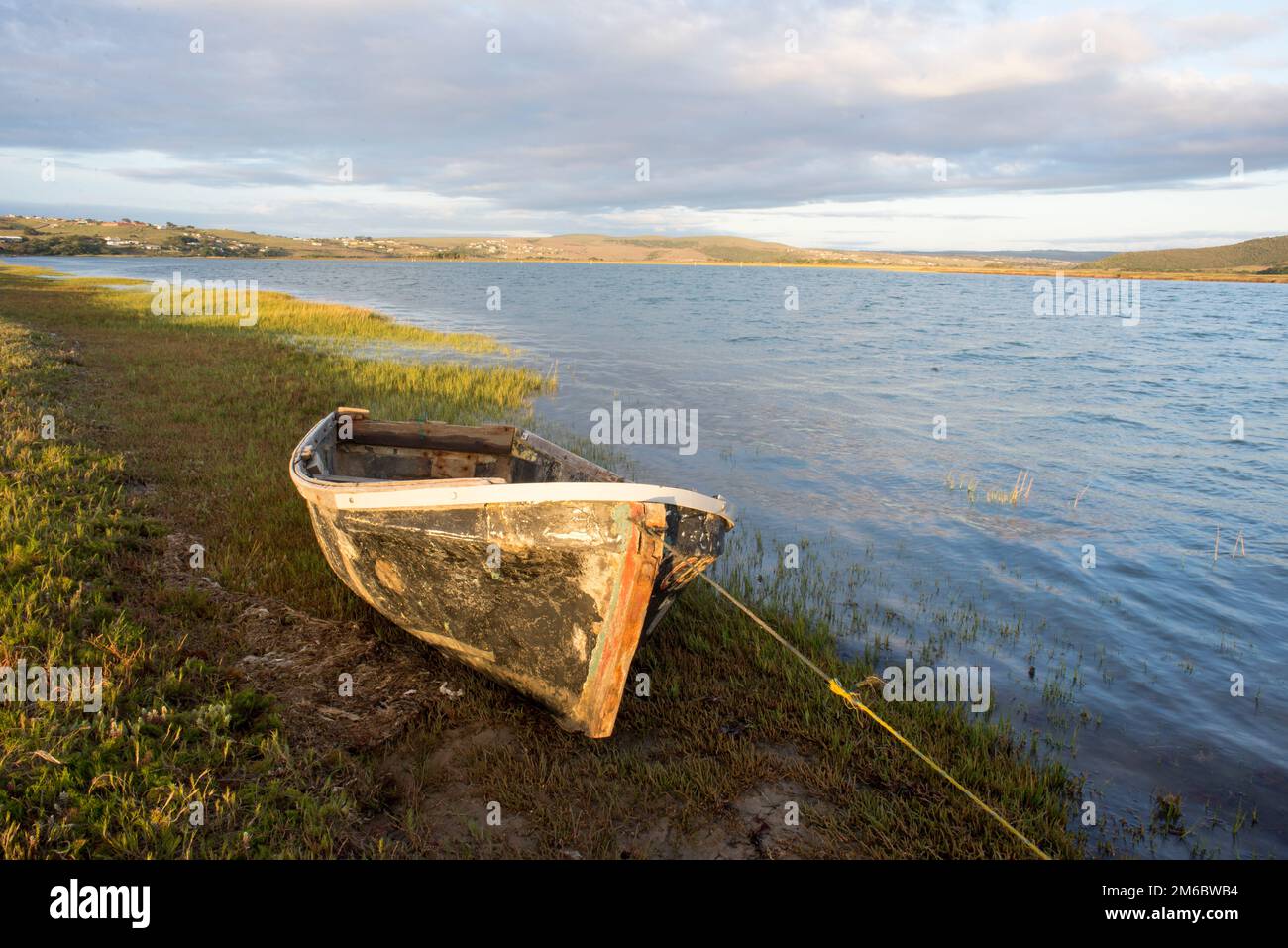 Old boat by the river Stock Photo - Alamy