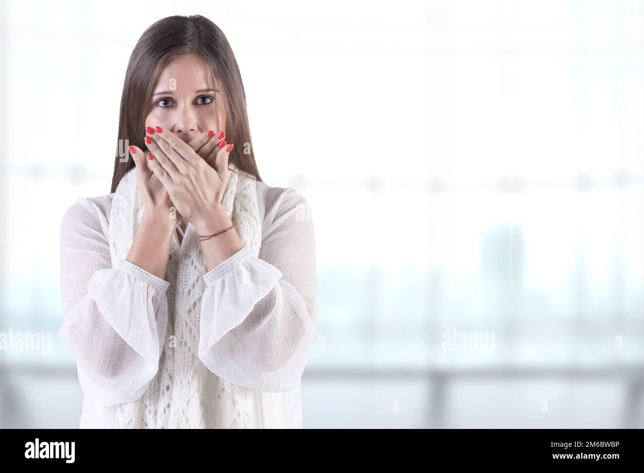 Woman Covering Her Mouth Stock Photo