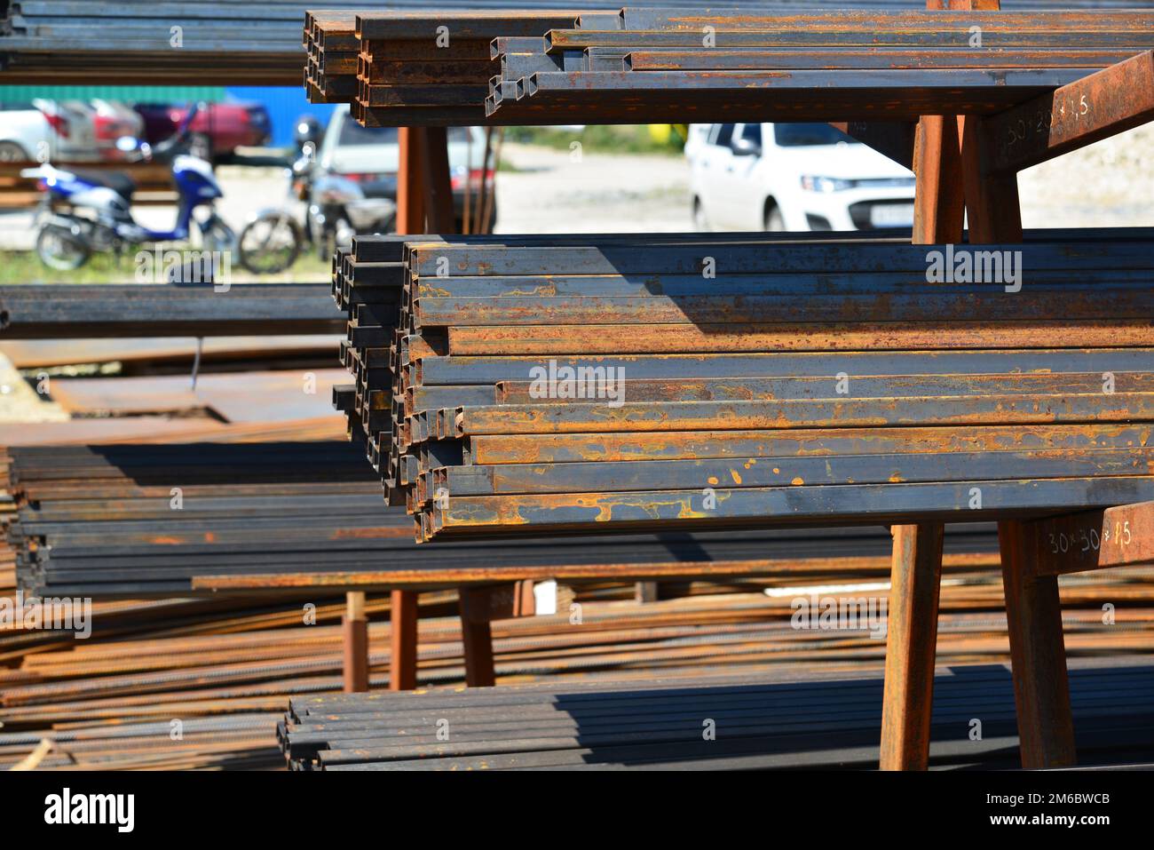 Rust metal quadratic profile lies in heap Stock Photo - Alamy
