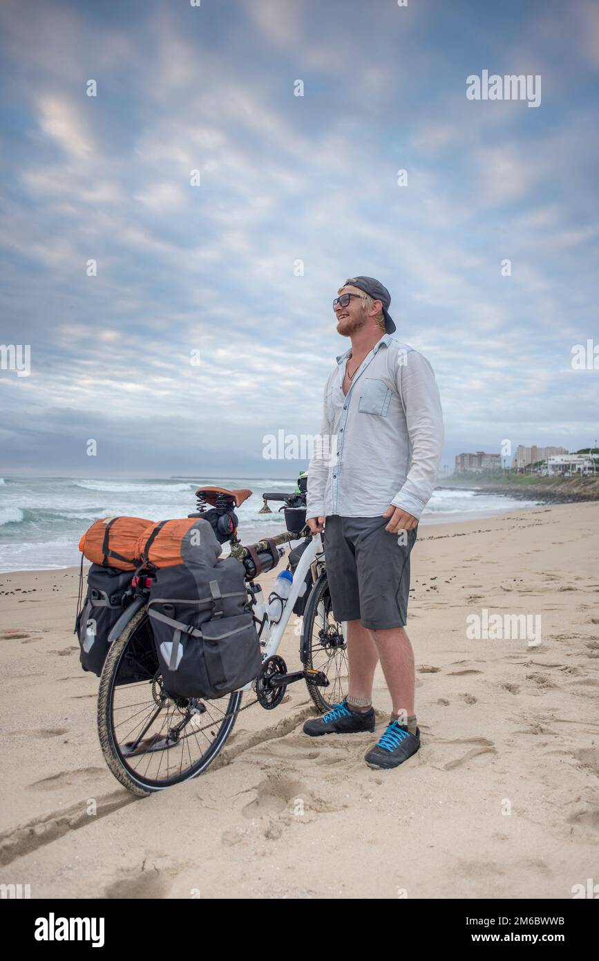 Adventure Cyclist on Beach with Bicycle Stock Photo Alamy