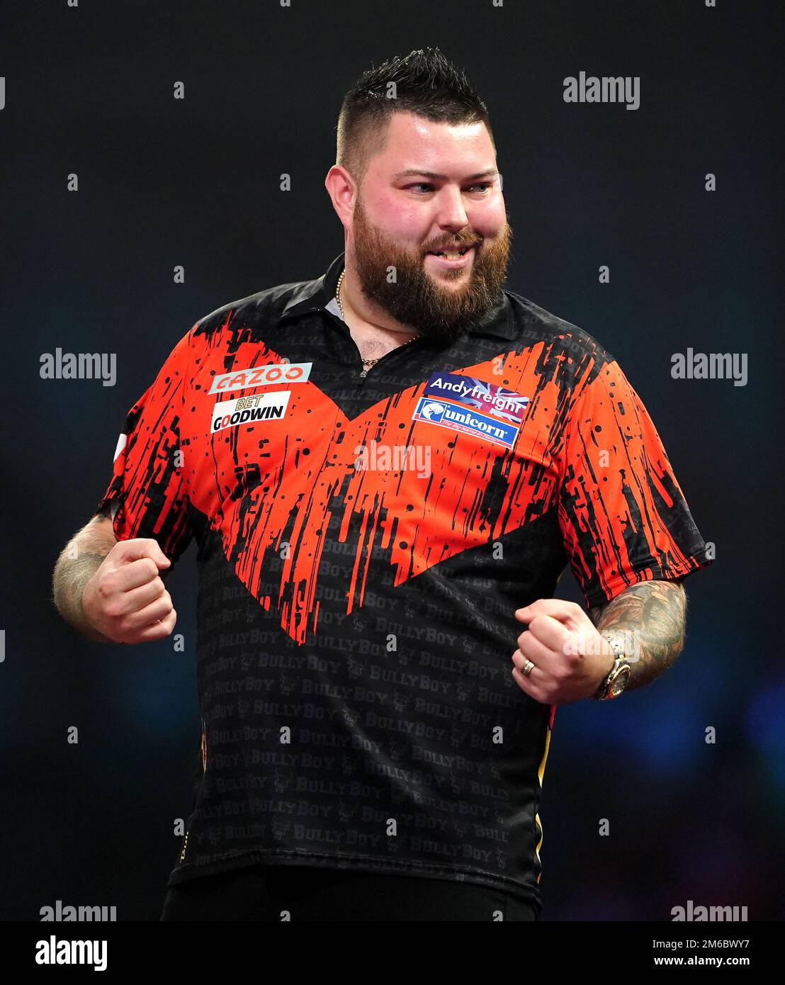 Michael Smith celebrates winning a set with a ninedarter during the