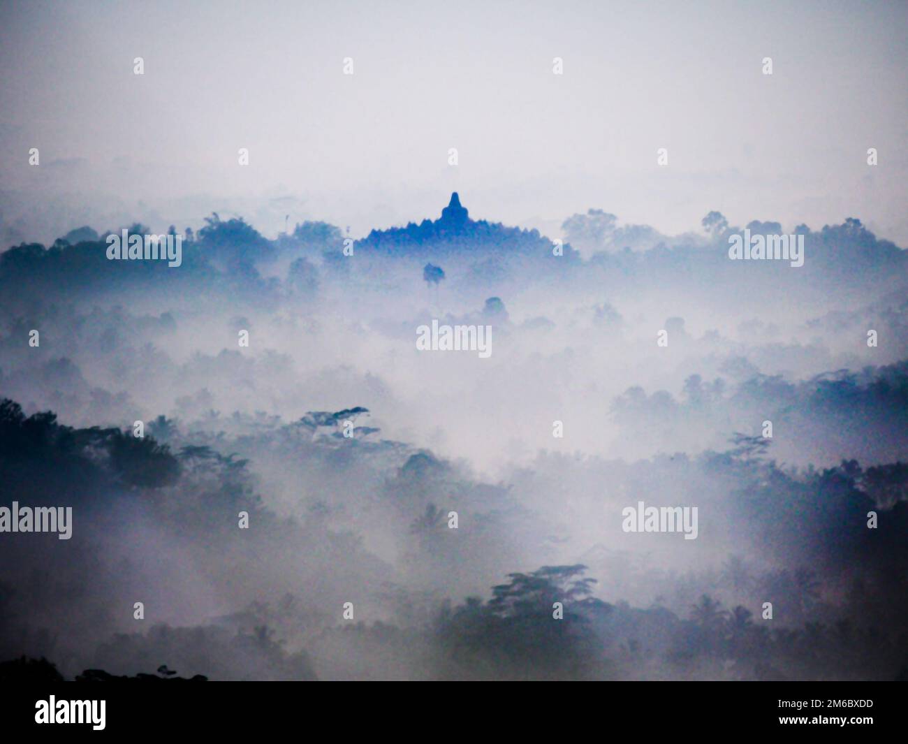 Sunrise Over Indonesian Landscape and Borobudur Temple Stock Photo
