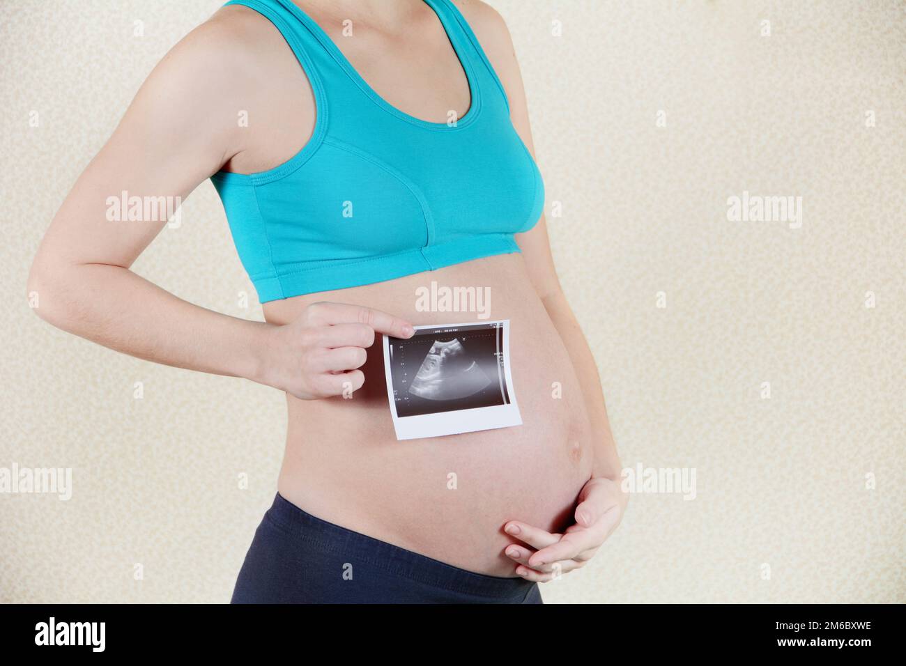 Young pregnant woman stretching hi-res stock photography and images - Alamy