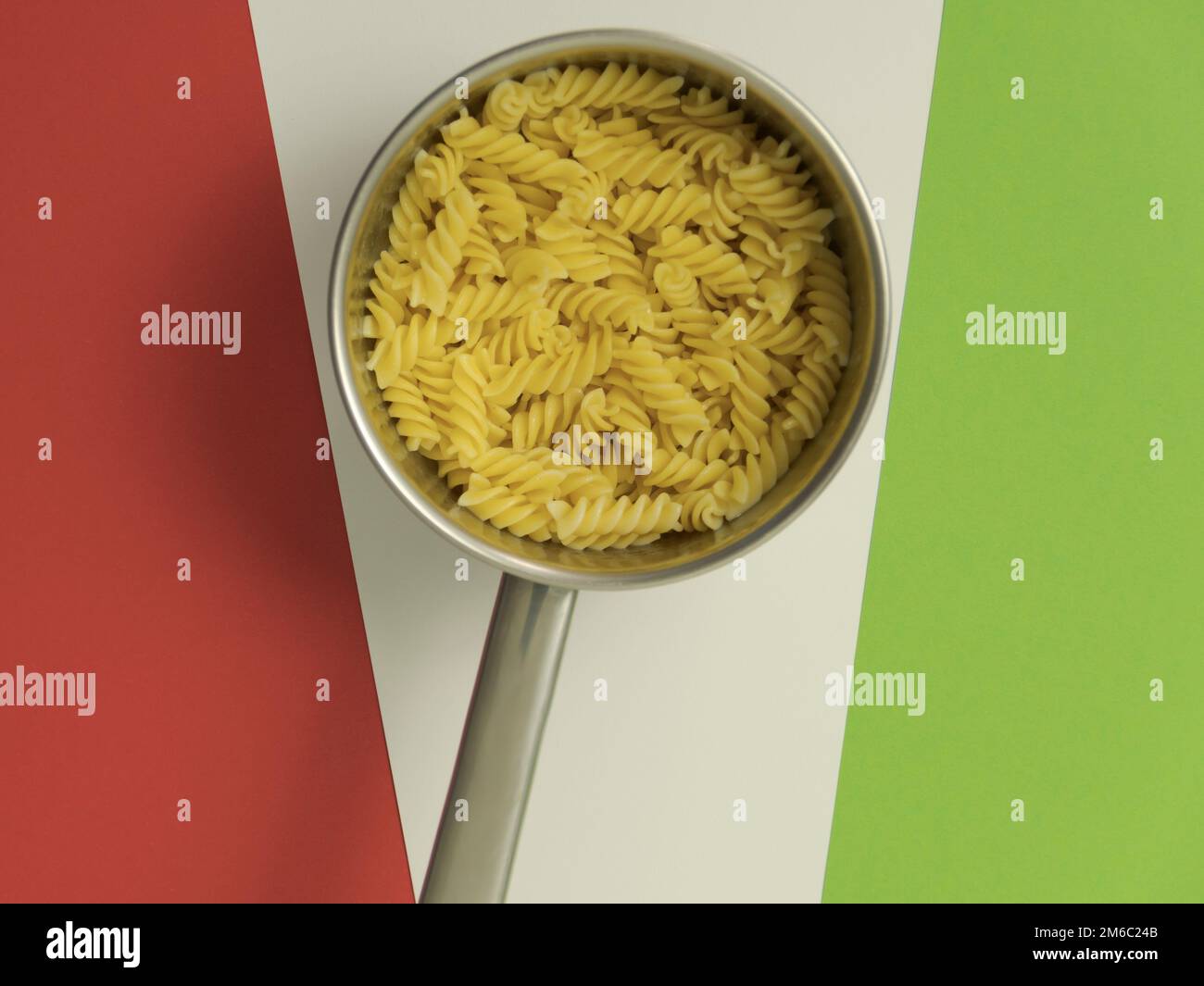 Pasta In Saucepan On The Green Red White Background Close Up Italian Pasta in saucepan on the green red white background close up italian