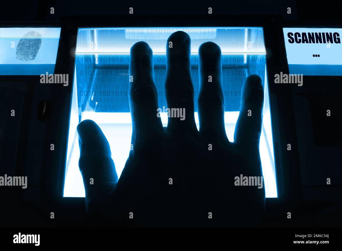 A person uses a fingerprint scanner. Can be used for biometrics or cybersecurity concepts. Stock Photo