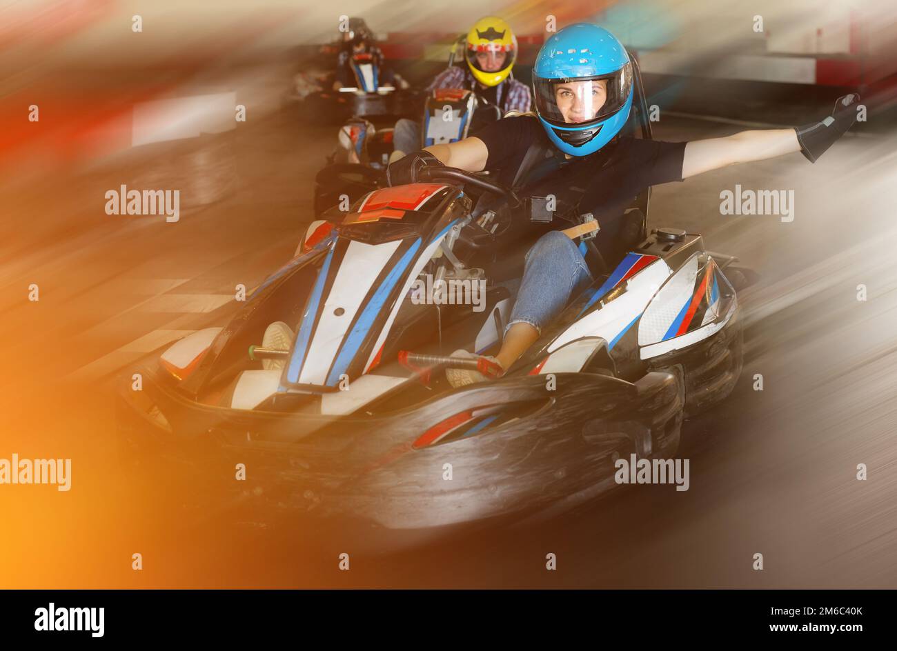 People driving gokart cars Stock Photo Alamy