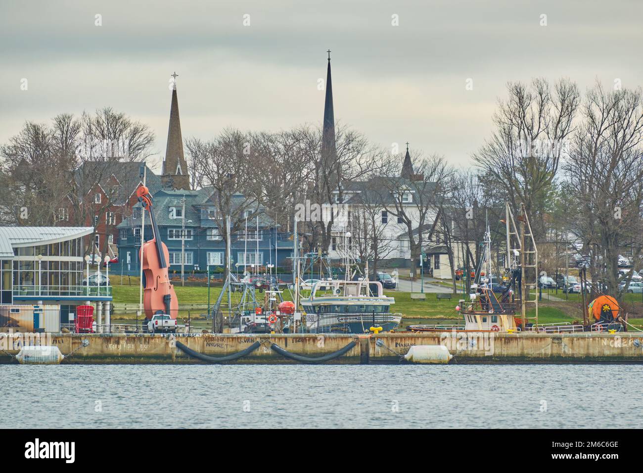 Photograph of the cruise docks in Sydney Nova Scotia from across the harbour.  Every year Sydney welcomes many cruise ships from around the world and Stock Photo