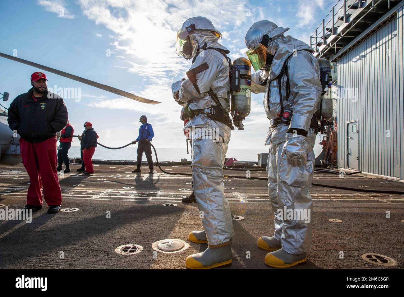 At Sea. 29th Dec, 2022. Sailors assigned to the Ticonderoga-class guided-missile cruiser USS Leyte Gulf (CG 55) prepare to rescue personnel during an aircraft firefighting drill, Dec. 22, 2022. The George H.W. Bush Carrier Strike Group is on a scheduled deployment in the U.S. Naval Forces Europe area of operations, employed by U.S. Sixth Fleet to defend U.S., allied, and partner interests. Credit: Christine Montgomery/U.S. Navy/ZUMA Press Wire Service/ZUMAPRESS.com/Alamy Live News Stock Photo