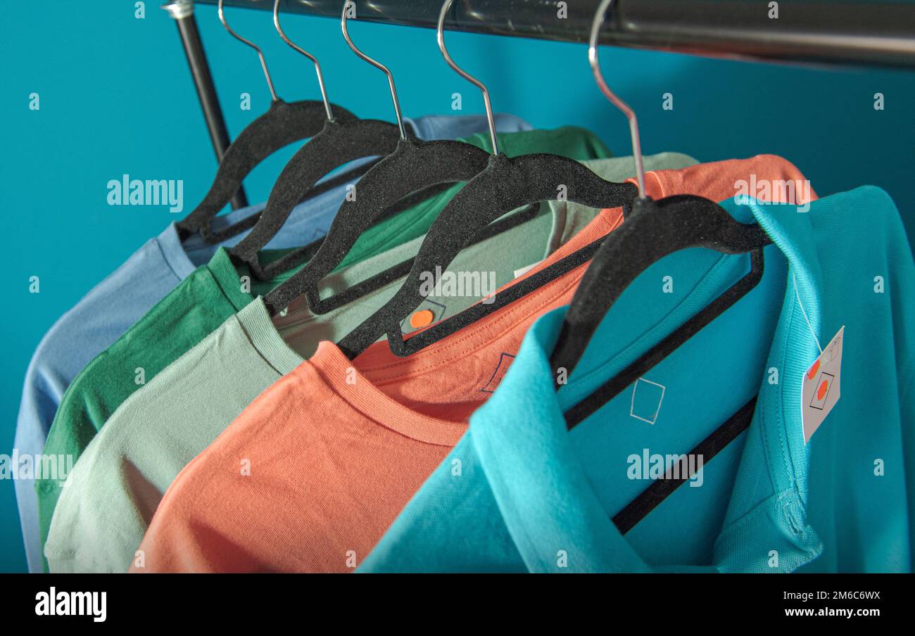 clothes in the warehouse are covered with dust Stock Photo