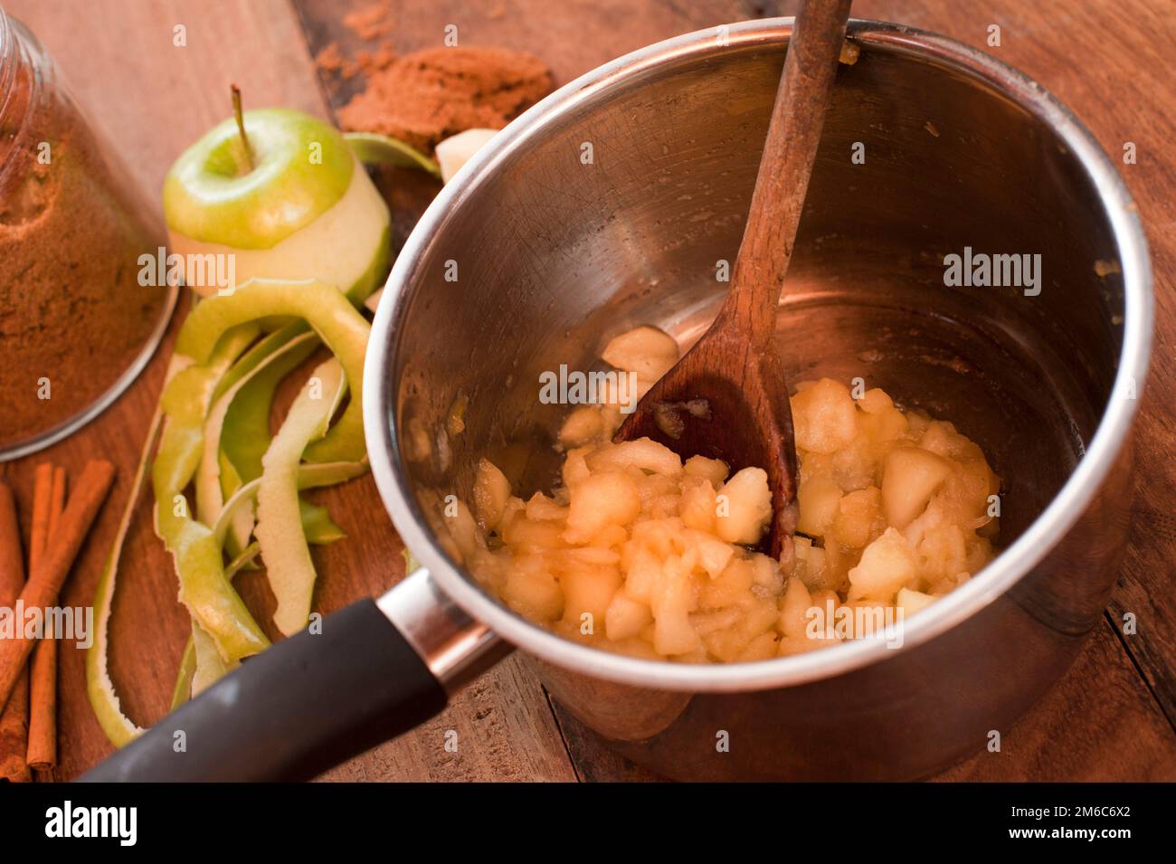 Cooking fresh diced apples to make a sauce Stock Photo Alamy