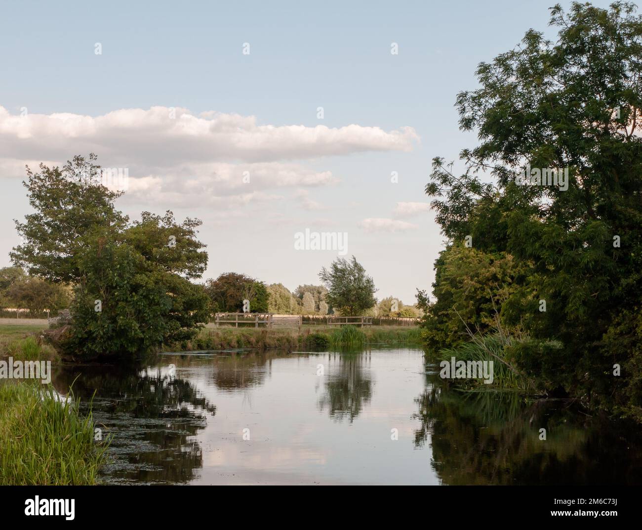 A beautiful country scene of the stour river in dedham with trees reflected in the water Stock Photo
