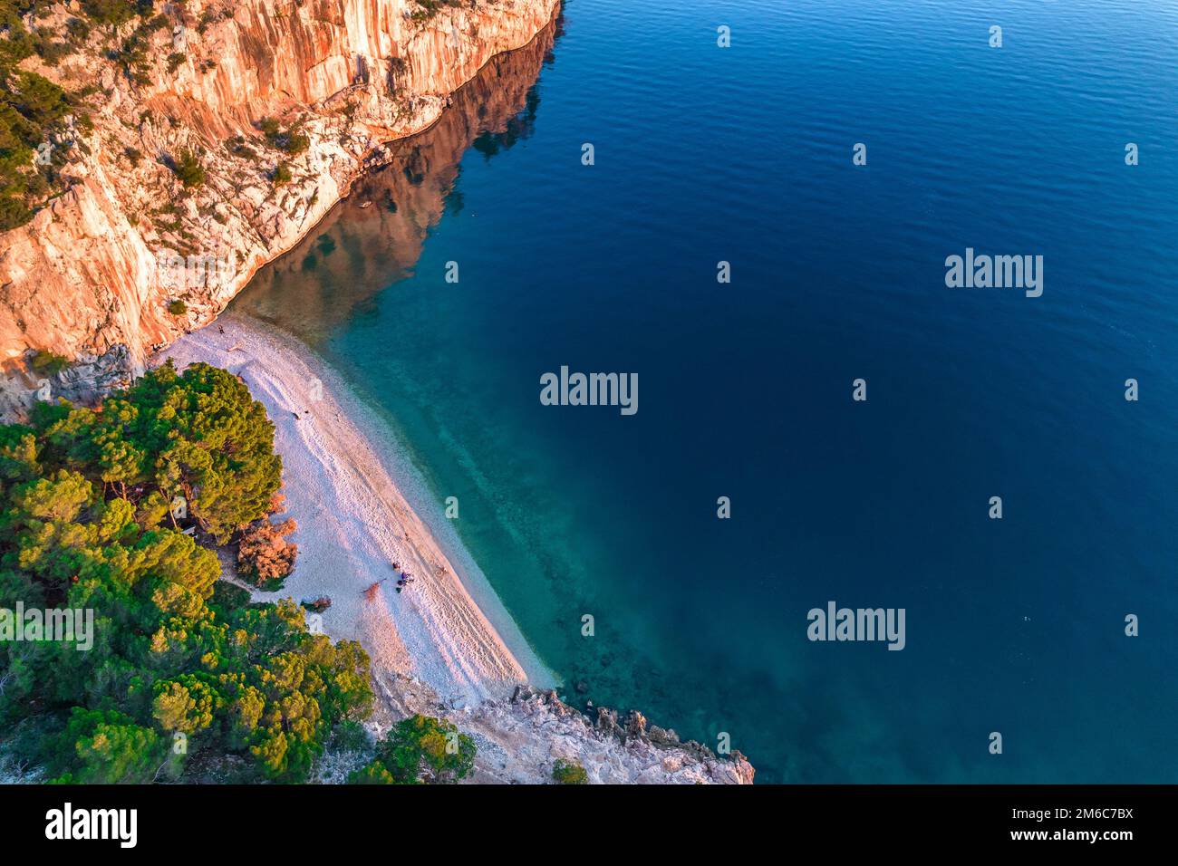 Nugal Beach. Nude beach on the Makarska riviera in Croatia. Adriatic sea pebble beach. The beach among mountains. Stock Photo