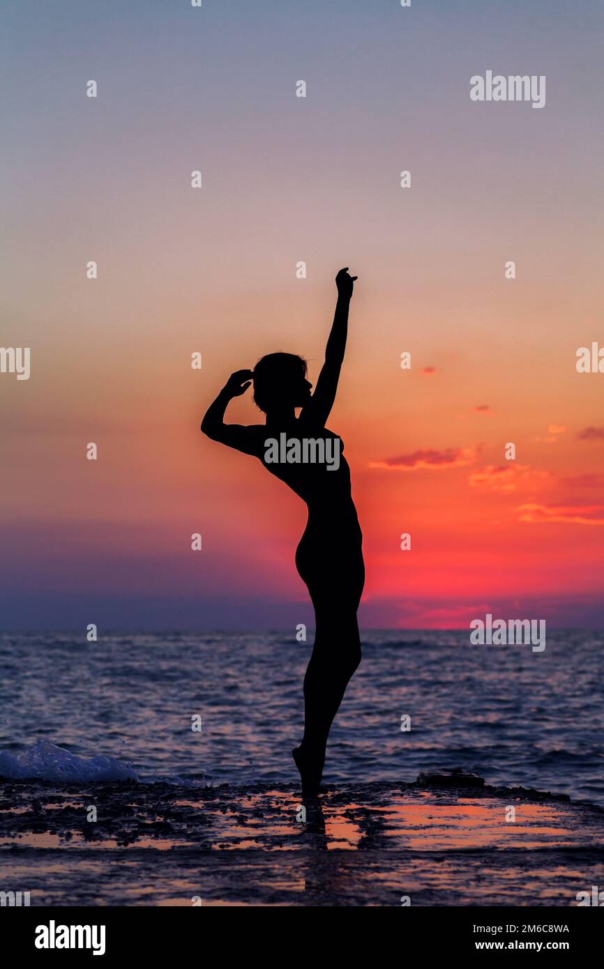 Dance at sunset. Vertical image Stock Photo