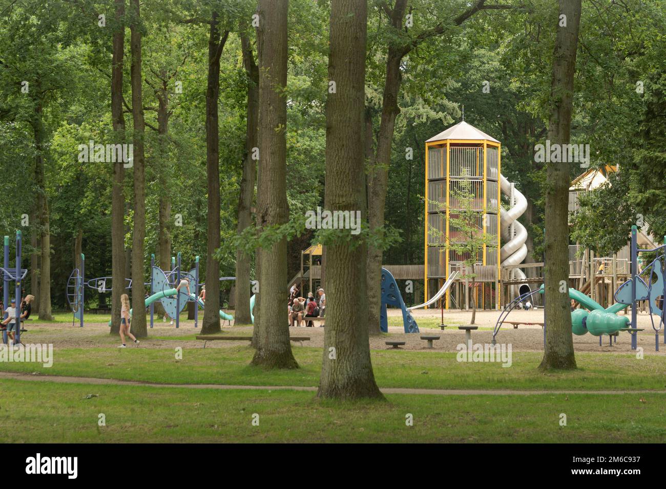 Playground with children's attractions in the forest park. Europe Stock