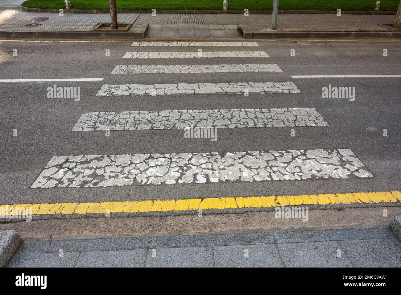 Pedestrian crossing the roadway on the city street Stock Photo