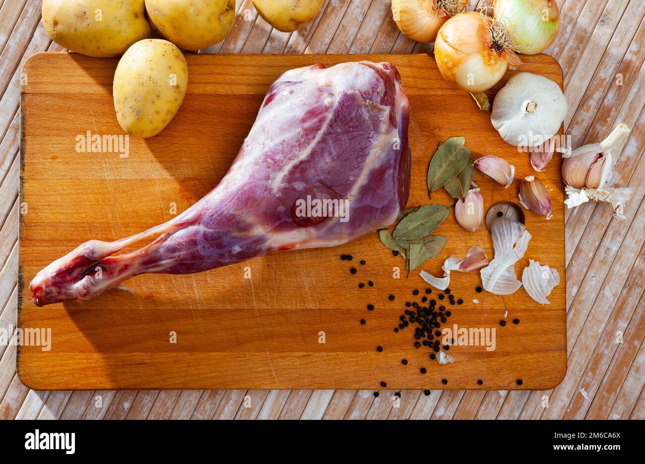 Raw lamb leg with natural ingredients before cooking Stock Photo Alamy