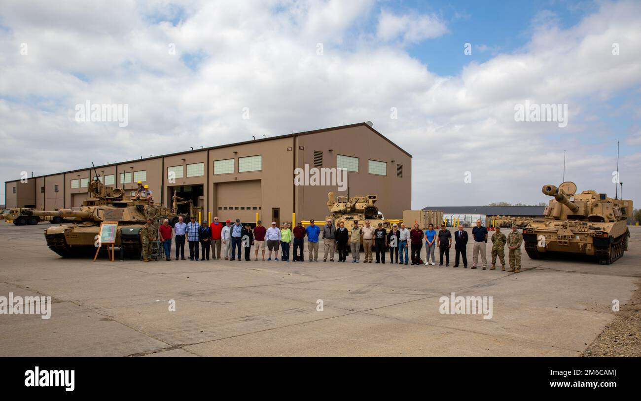 Officers of the 1st Infantry Division pose at the 1st Combined Arms Battalion, 18th Infantry Regiment, 2nd Armored Brigade Combat Team, 1st Infantry Division, motor pool on Fort Riley, Kansas, April 22, 2022. Officers with the Society of the 1st Infantry Division visited the motor pool as part of their tour of the post. Stock Photo