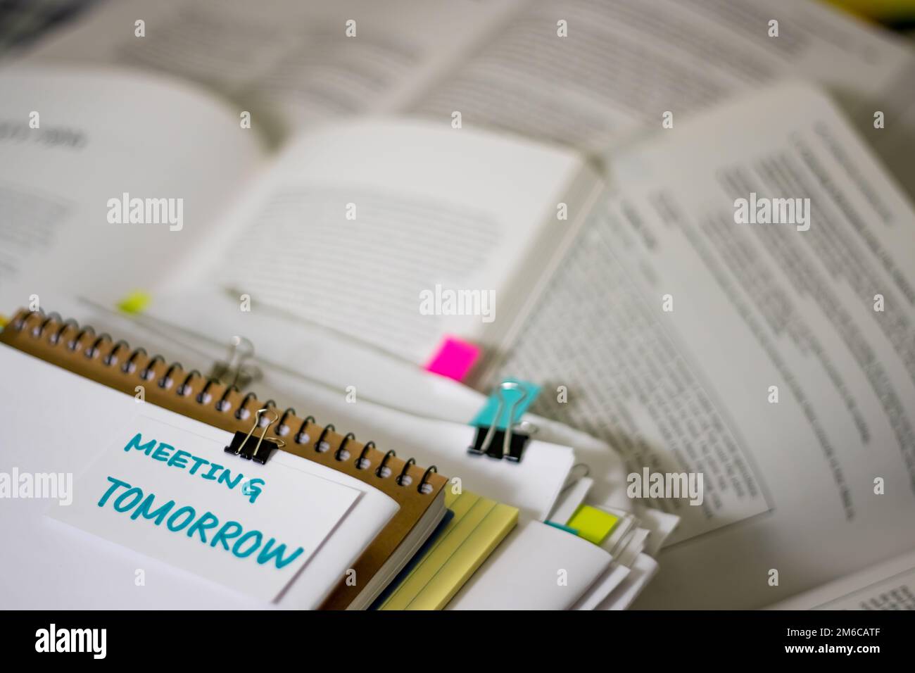 Meeting Tomorrow; Stack of Documents with Large Amount of Reading