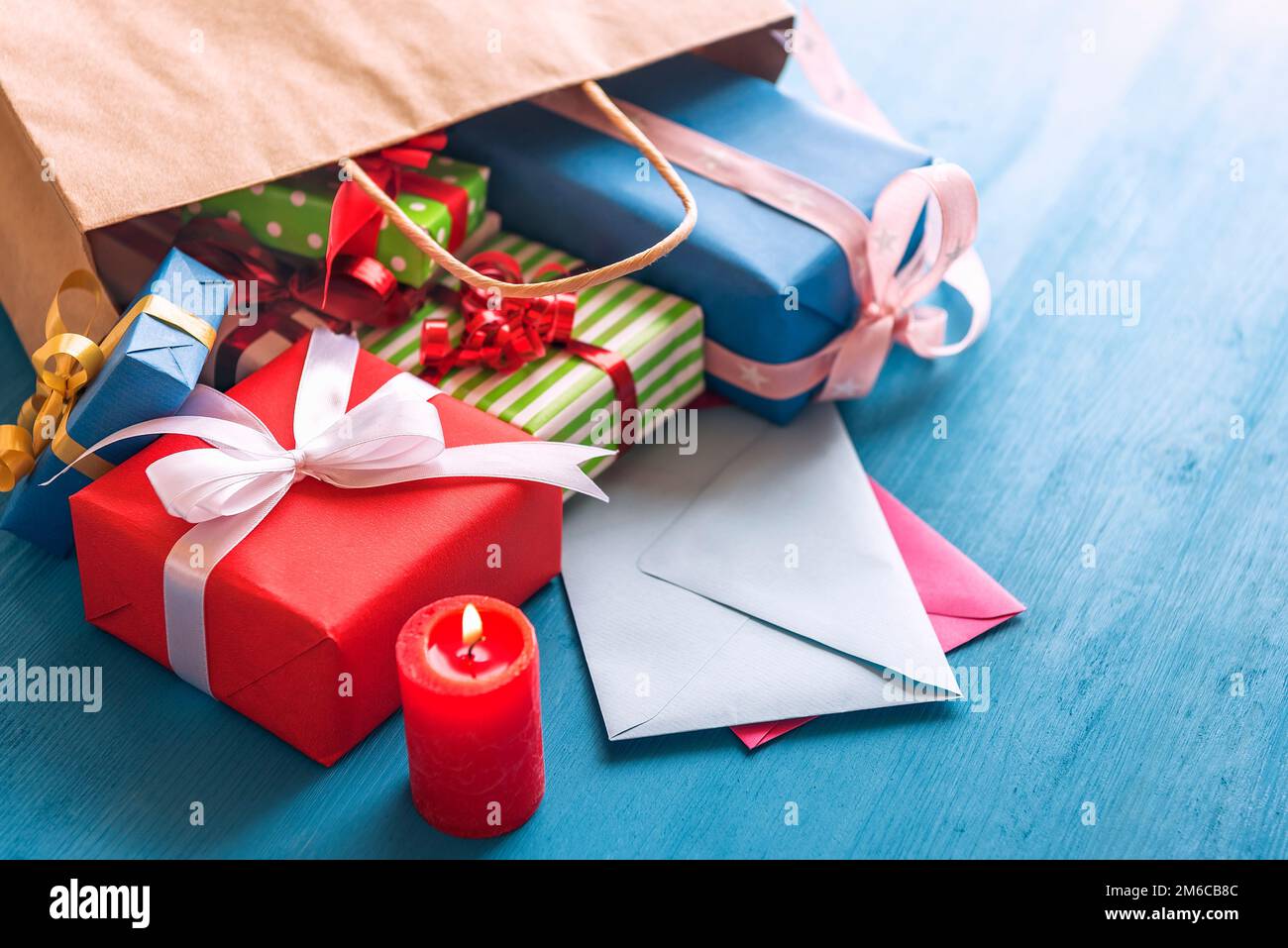 Gift bag overturned on the table Stock Photo