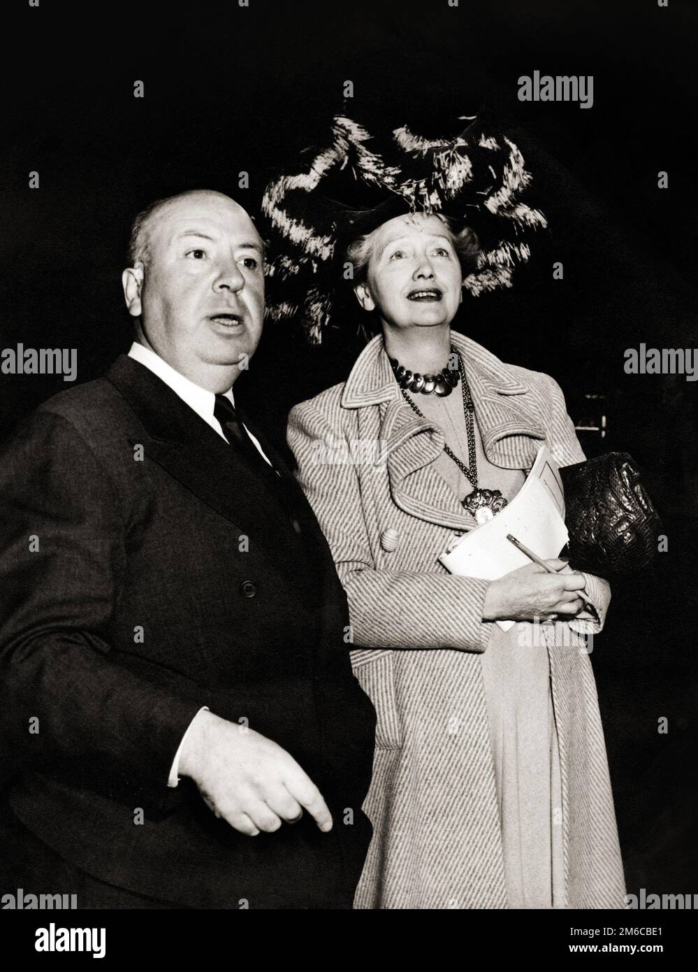 Alfred Hitchock with Hedda Hopper (1940s) Stock Photo