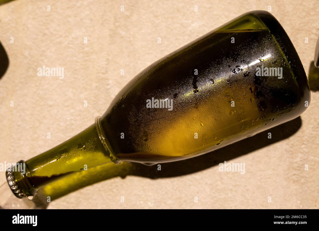 Champagne bottle during second fermentation with lees or dead yeast