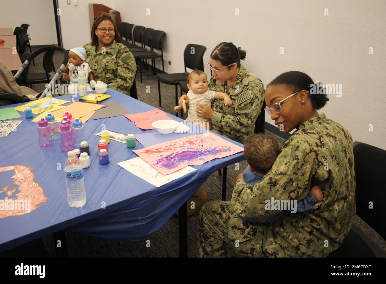 Taking a break form work for some mother-baby bonding time Stock Photo ...