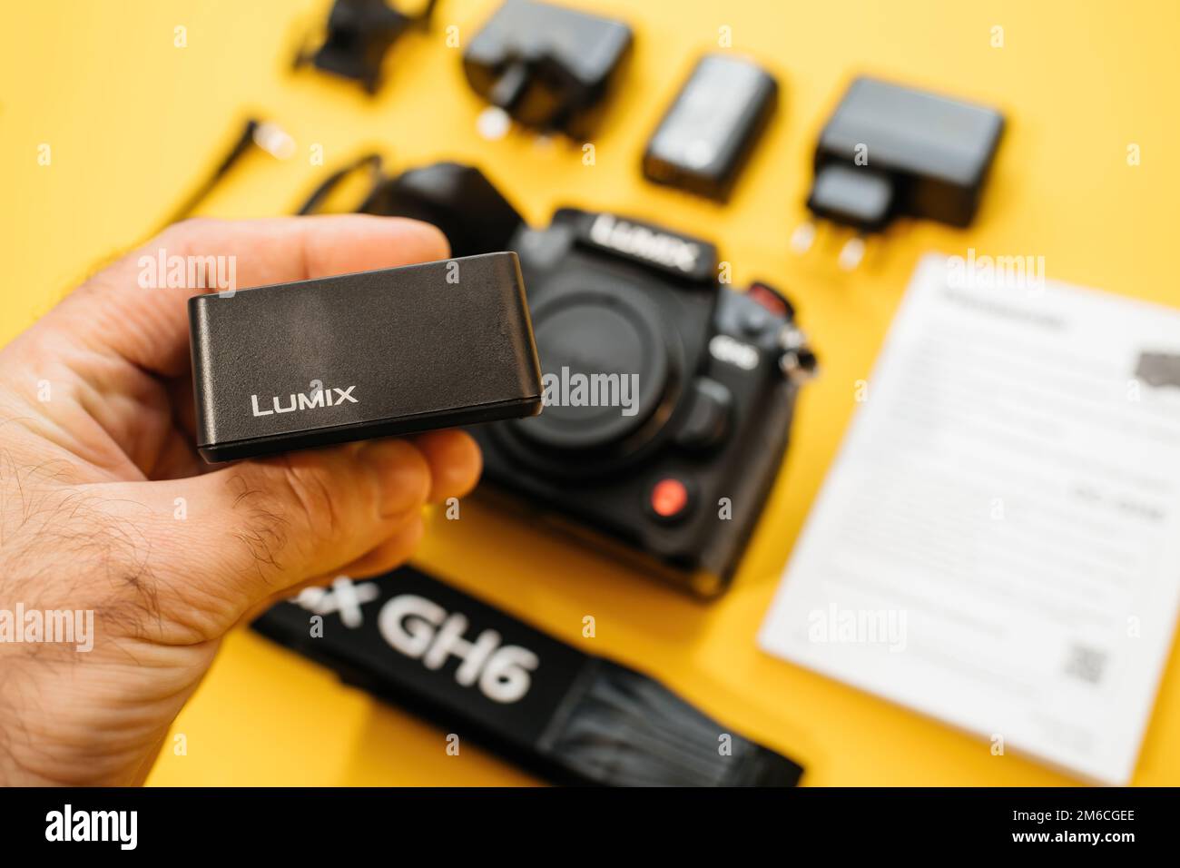 Paris, France Nov 20, 2022 Male hand holding Lumix VSK0815L charger