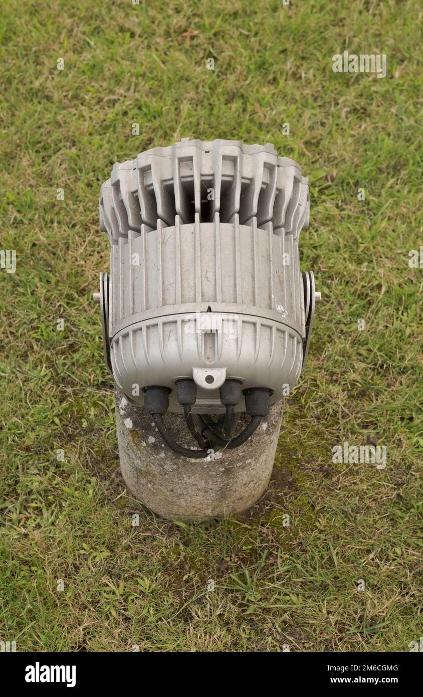 Powerful electric floodlight on the lawn for outdoor use Stock Photo