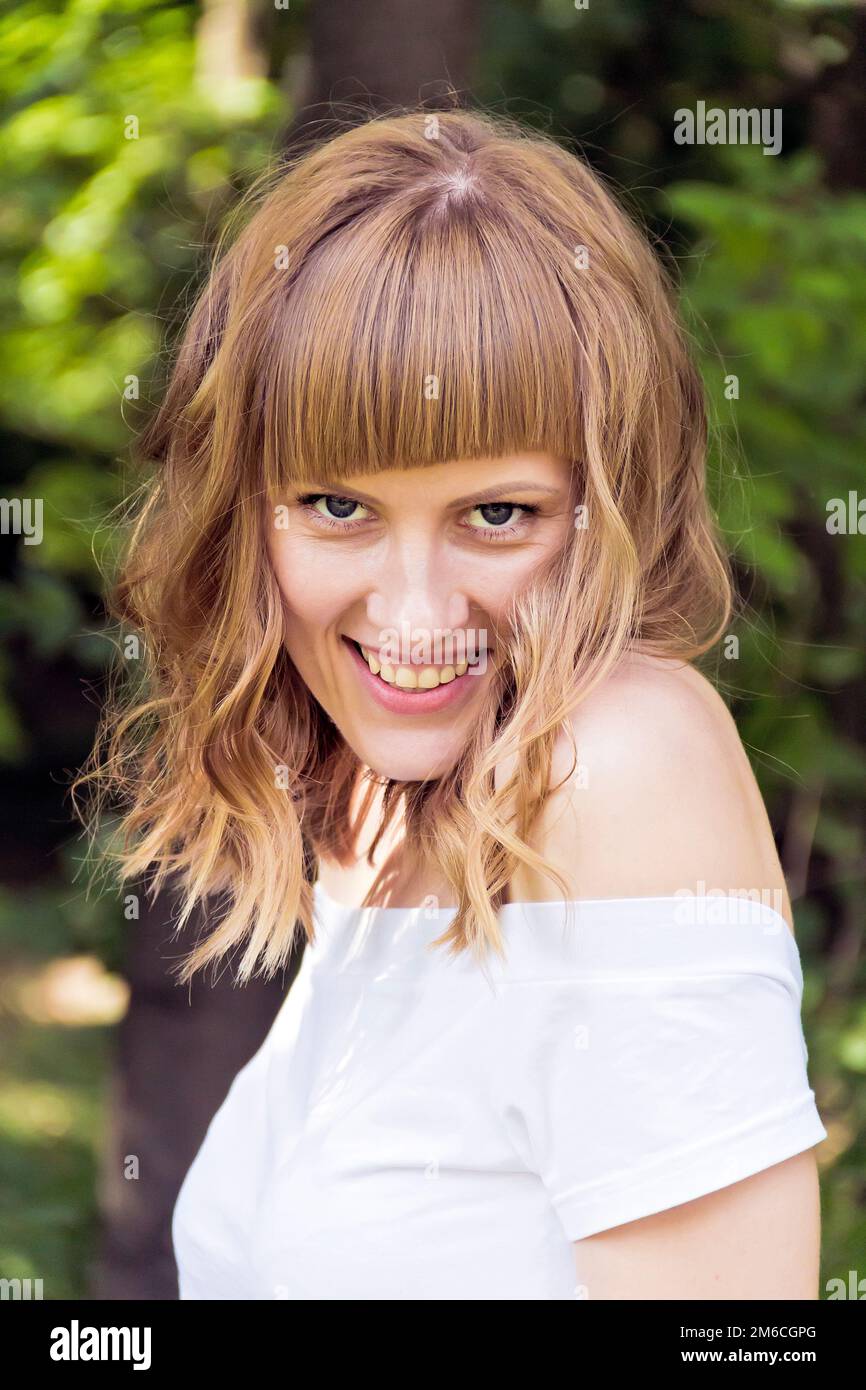 Portrait of young woman with blond hair Stock Photo - Alamy