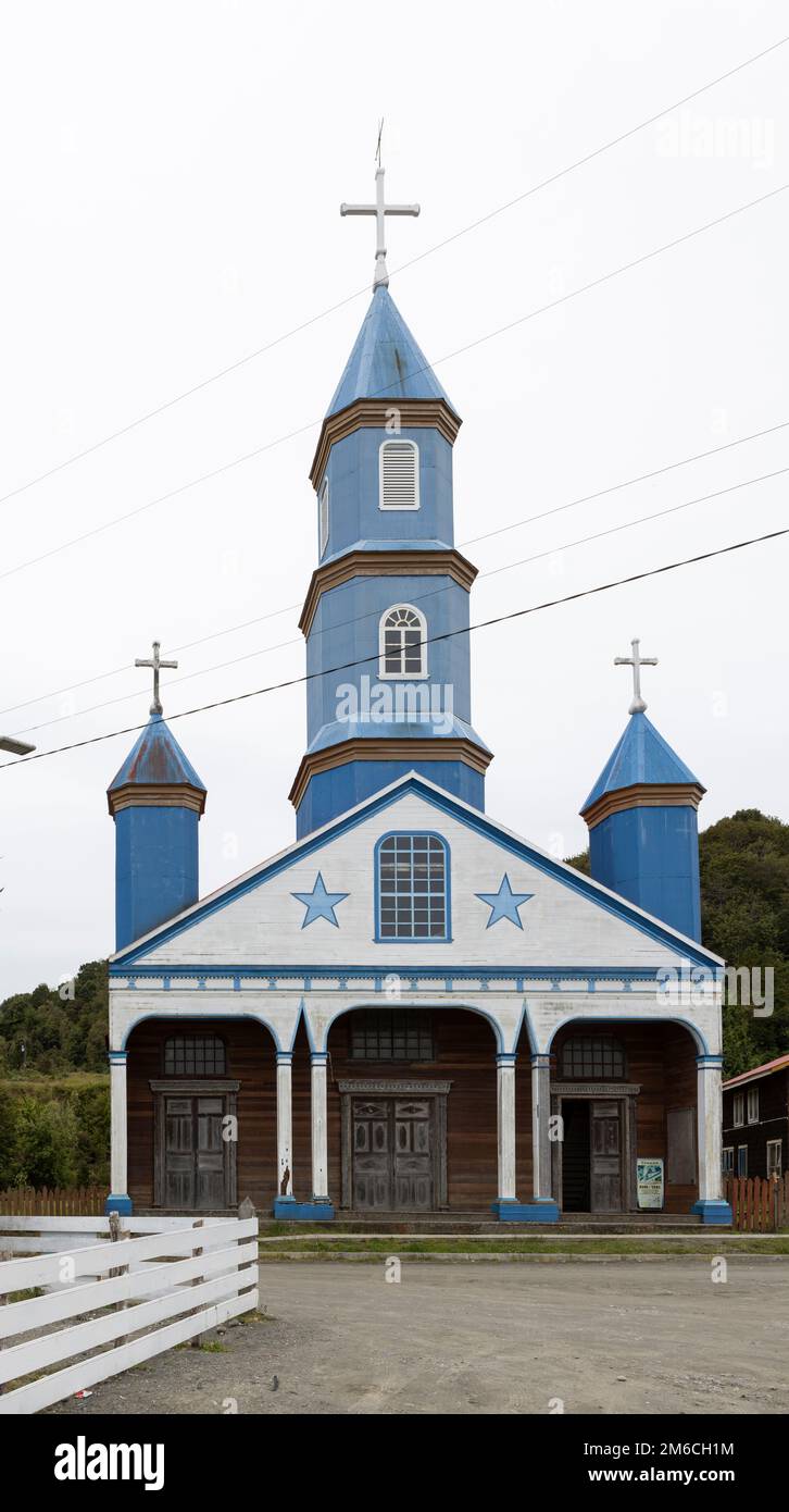 Beautiful church (Iglesia de Tenaún) completely made of wood and painted in blue and white in Tenaún on Chiloé (Isla Grande de Chiloé) in Chile Stock Photo