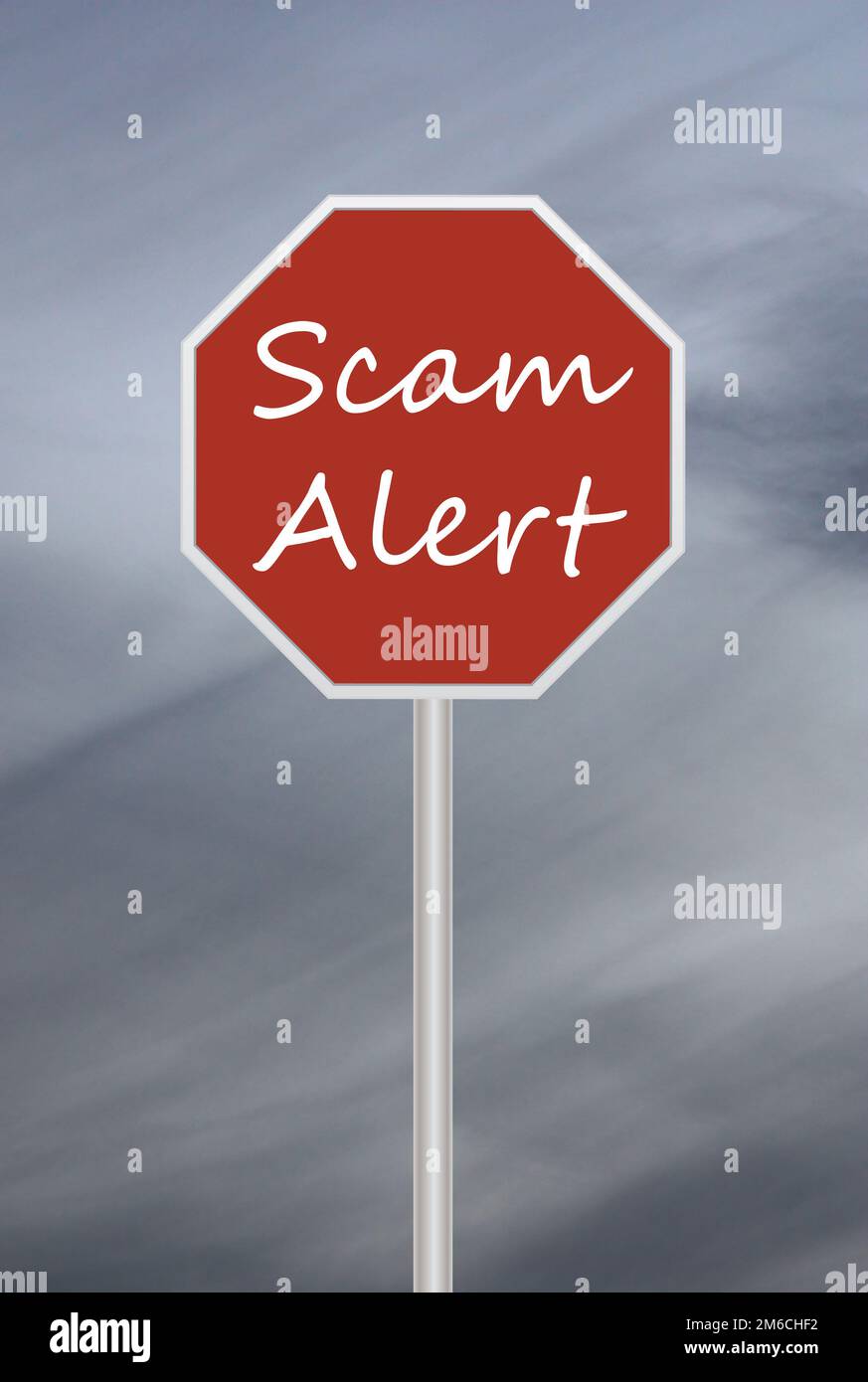 red stop sign for scam alert sign with dark moody sky Stock Photo