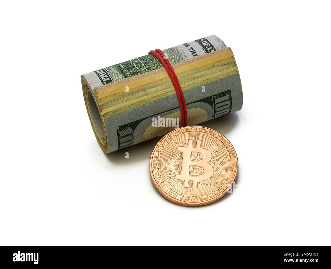 Platinum Bitcoin coin and cylinder of dollar bills on white background Stock Photo