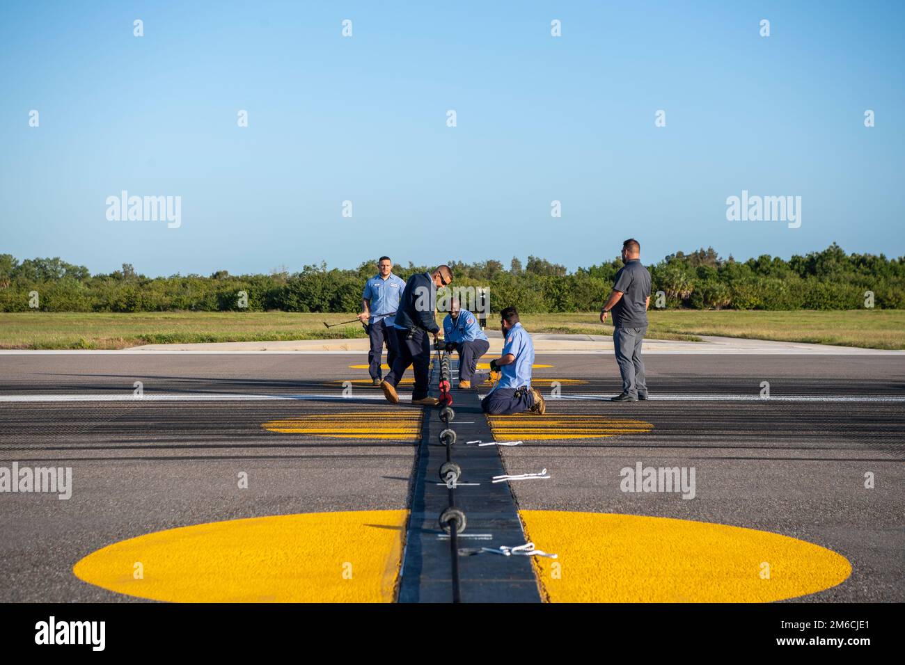 Support operations mechanics assigned 6th Civil Engineer Squadron prepare a Bak-12 aircraft arresting system at MacDill Air Force Base, Florida, April 22, 2022. Bak-12 systems are certified annually to be deemed operational in accordance with U.S. Air Force standards. Stock Photo