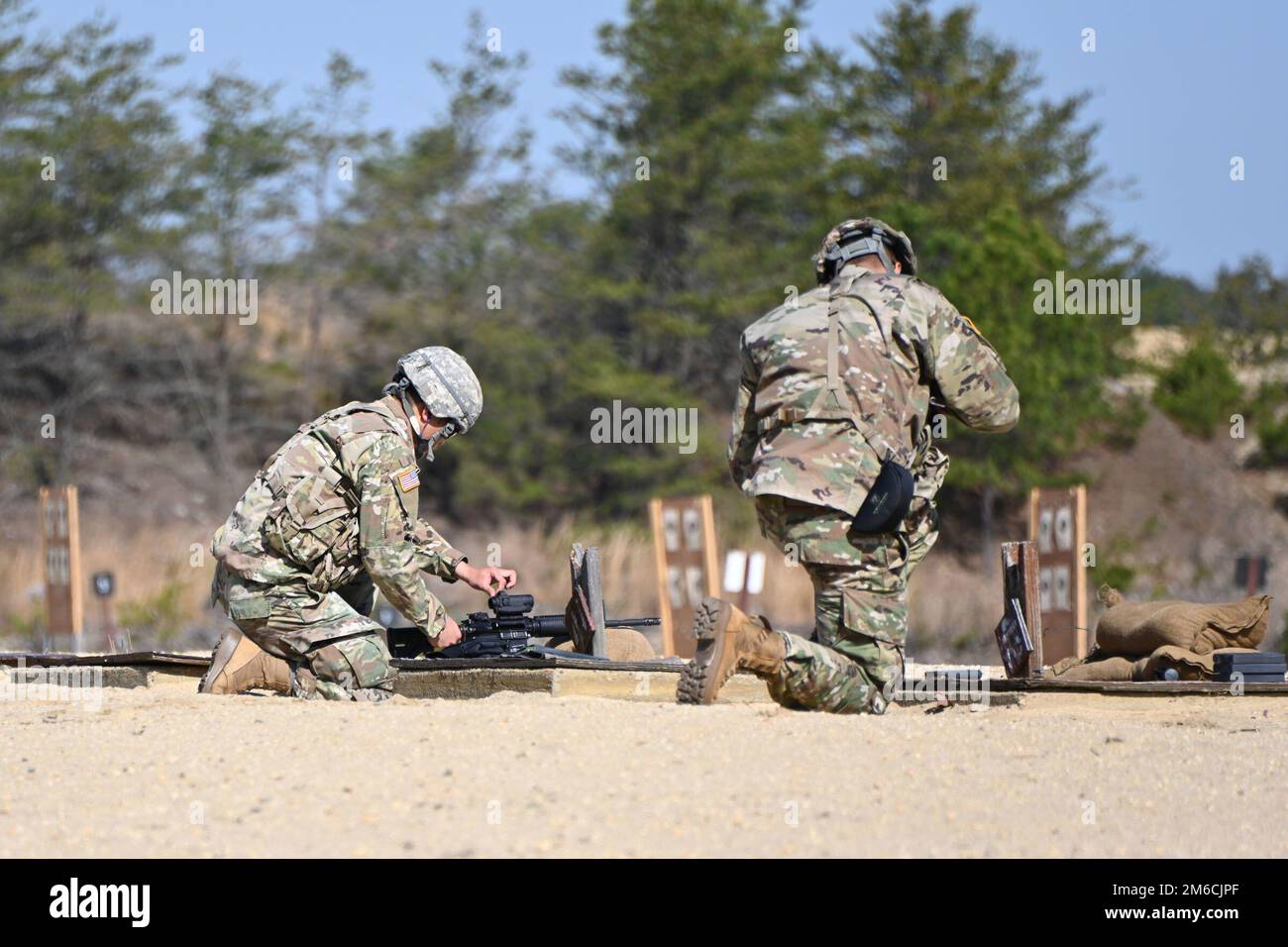 The solders are from Maryland and the D.C. area, 151st LOD (Legal Operations Detachment). They are on Range 28A on the Fort Dix Range Complex during  range training for M16A1. The object is to train and test soldiers on the skills necessary to detect, identify, engage and defeat stationary personnel targets in a tactical array. The secondary purpose is to provide realistic and effective marksmanship training. (Photos taken by the Fort Dix [TSC] Training Support Center) Stock Photo