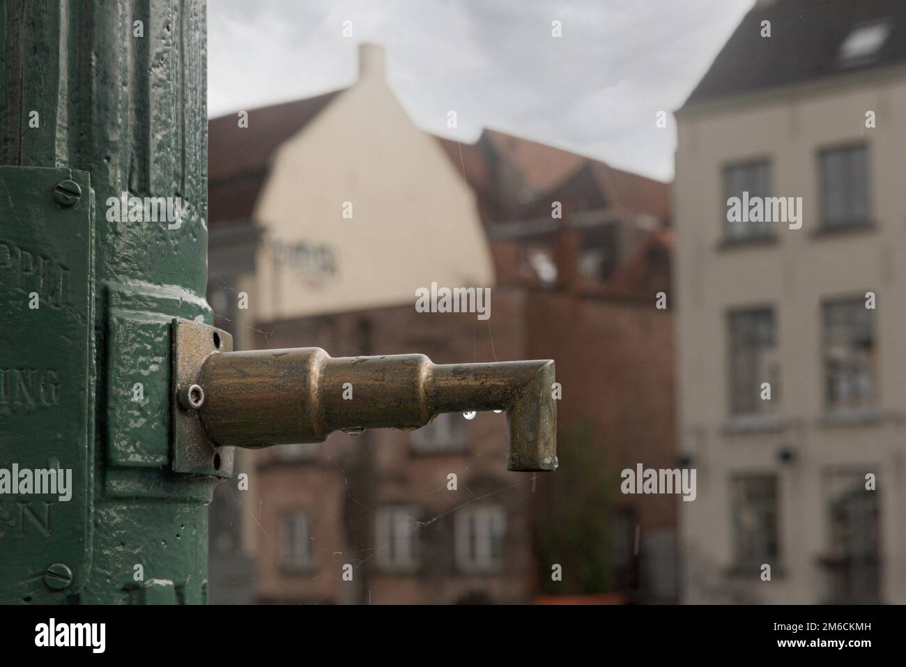 Ghent, Flemish Region-Belgium. 22-08-2021. Old copper faucet on the streets of Ghent Stock Photo