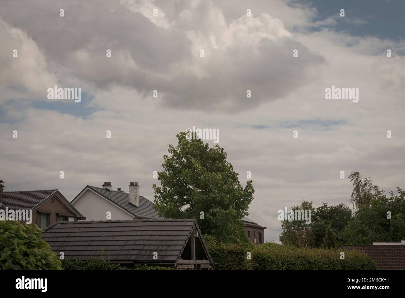 Hasselt. Limburg -Belgium 09-08-2021. Roofs of houses in bad weather. Cloudy sky before the rain Stock Photo
