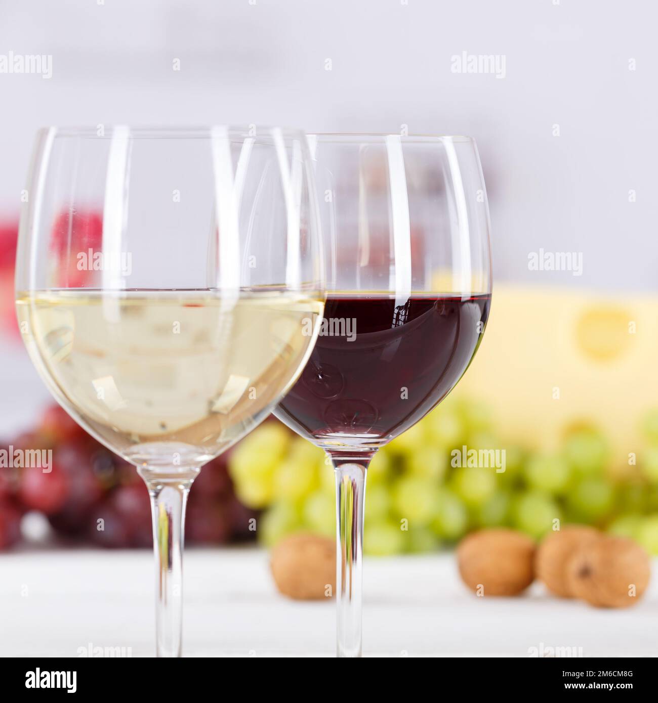 Wine glasses wine glasses white wine red wine white wine grapes square Stock Photo