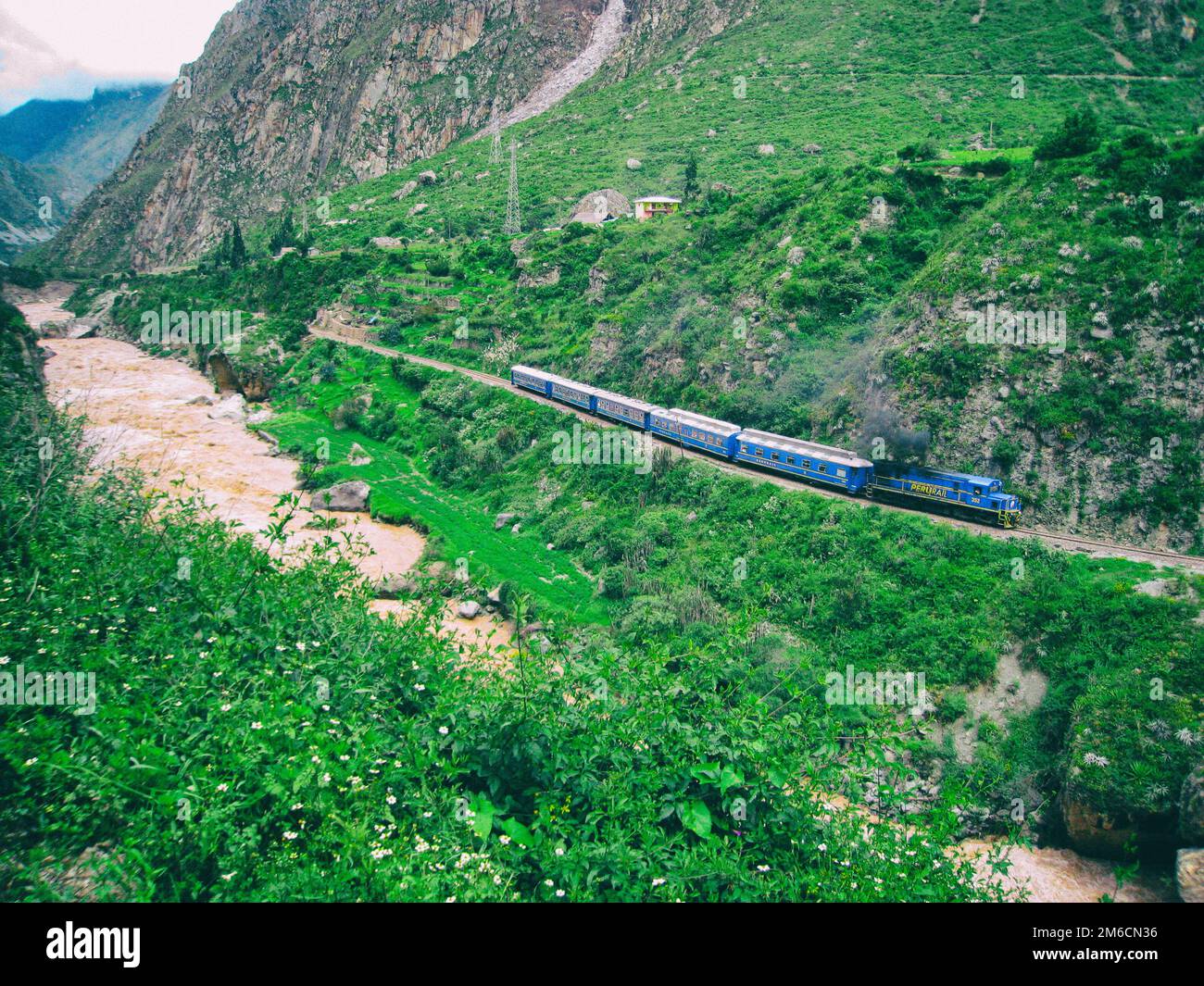 Blue train near red water stormy river Stock Photo Alamy