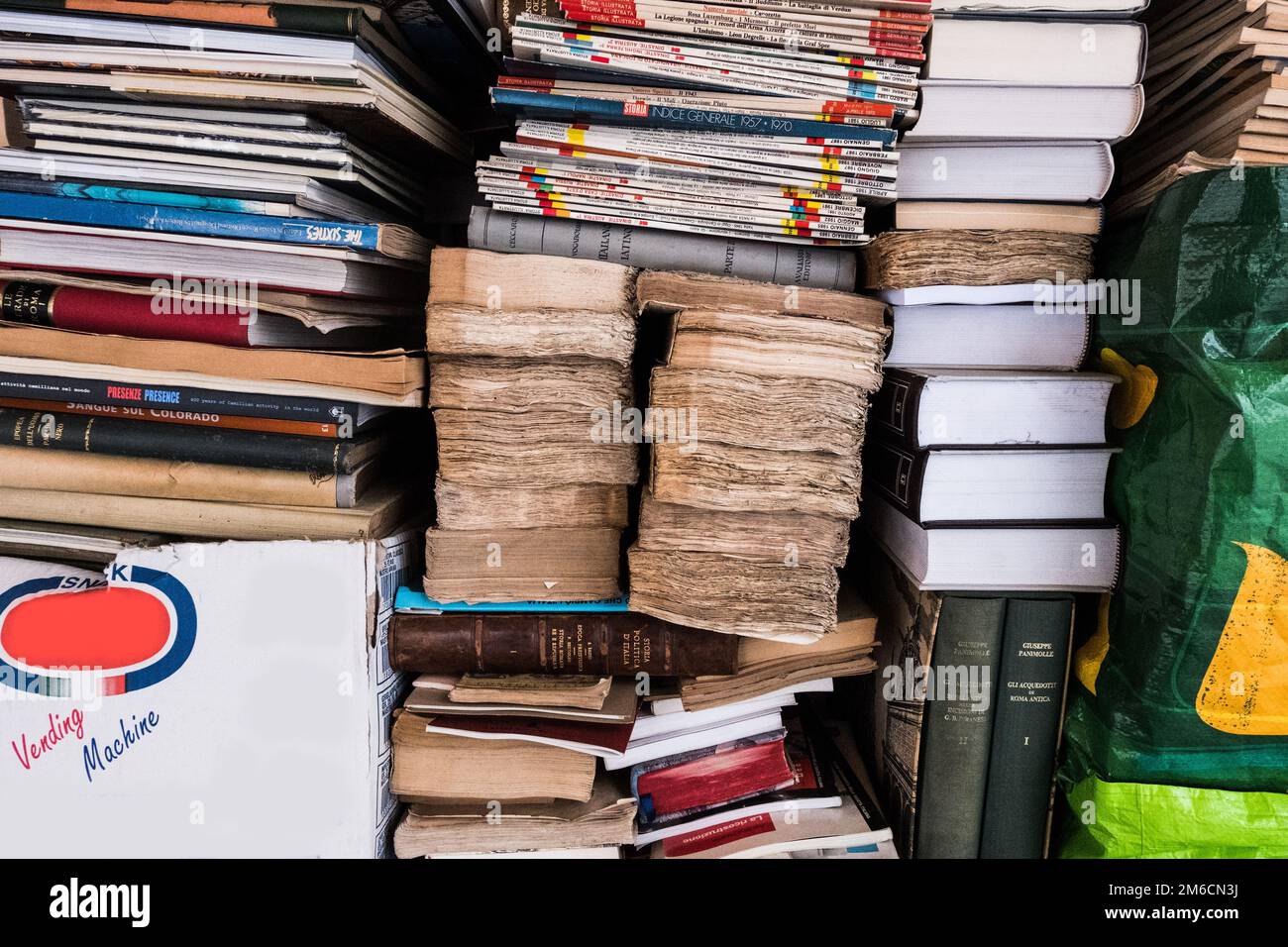 Piles of worn books of a street library. Stock Photo