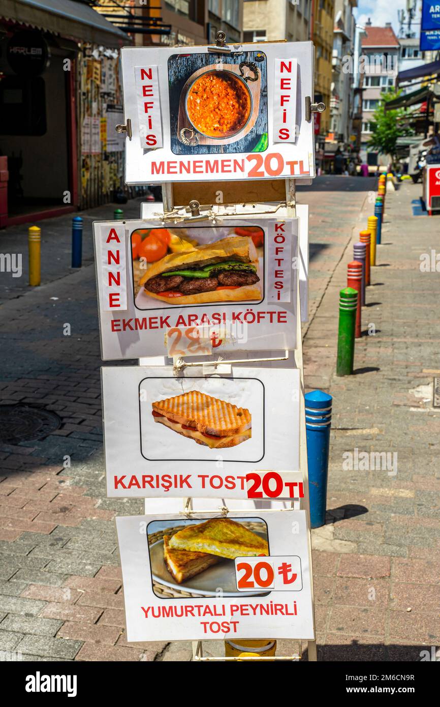 Traditional turkish food. Street food turkey. Poster with prices and foods descriptions, prices, nefis, menemen, karisik tost, anne koftesi. Kadikoy Stock Photo