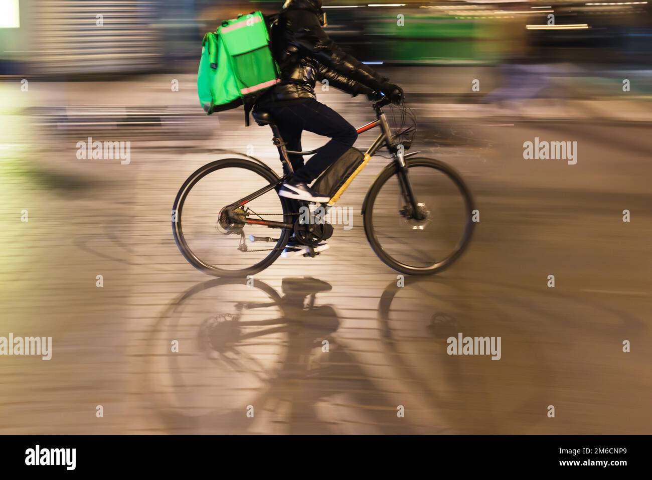 picture with intentional motion blur effect of a bicycle rider on a ...