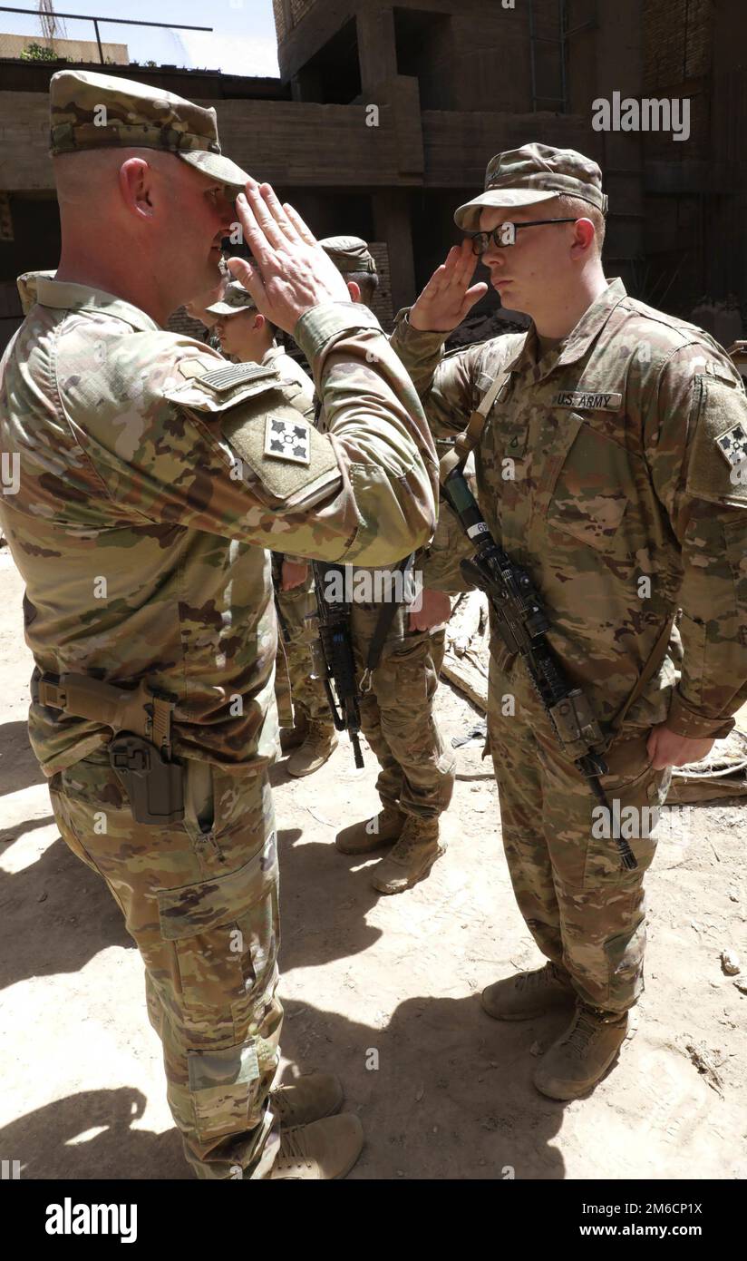 Lt. Col. Gregory Polk, the Task Force Pioneer commander, salutes a U.S ...