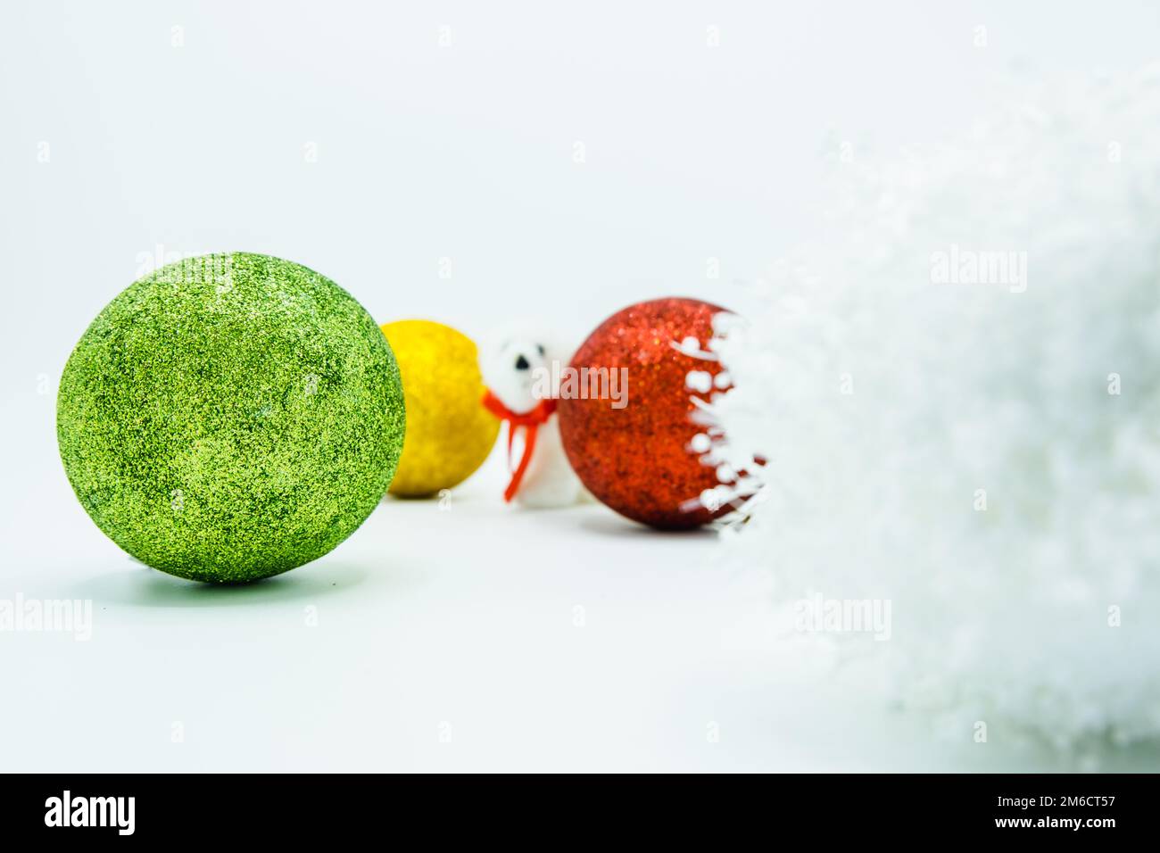 White, green, red, and golden christmas balls with polar bear. Stock Photo