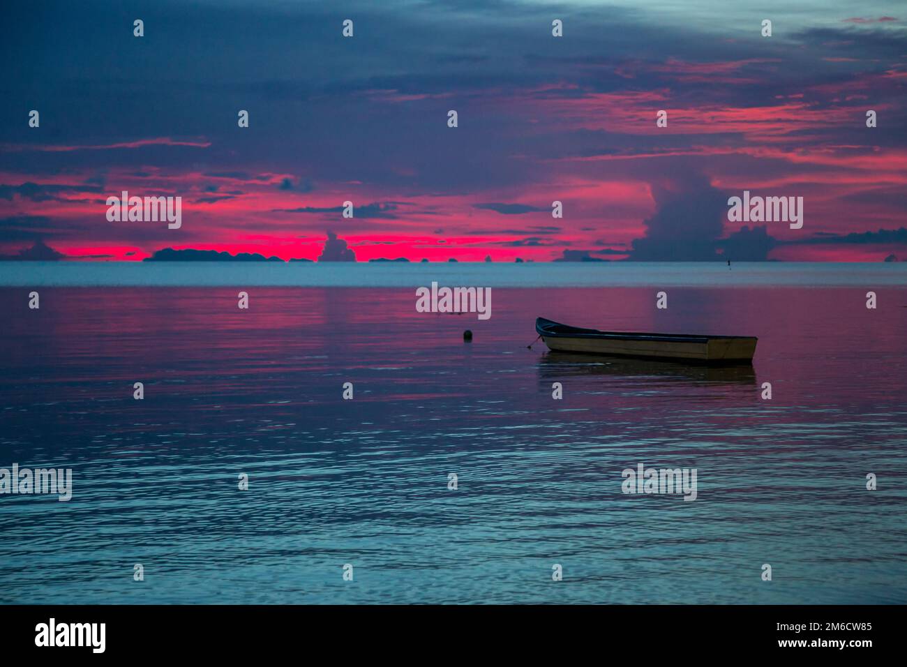 Colorful sunset over the sea. Dark dramatic sky Stock Photo - Alamy
