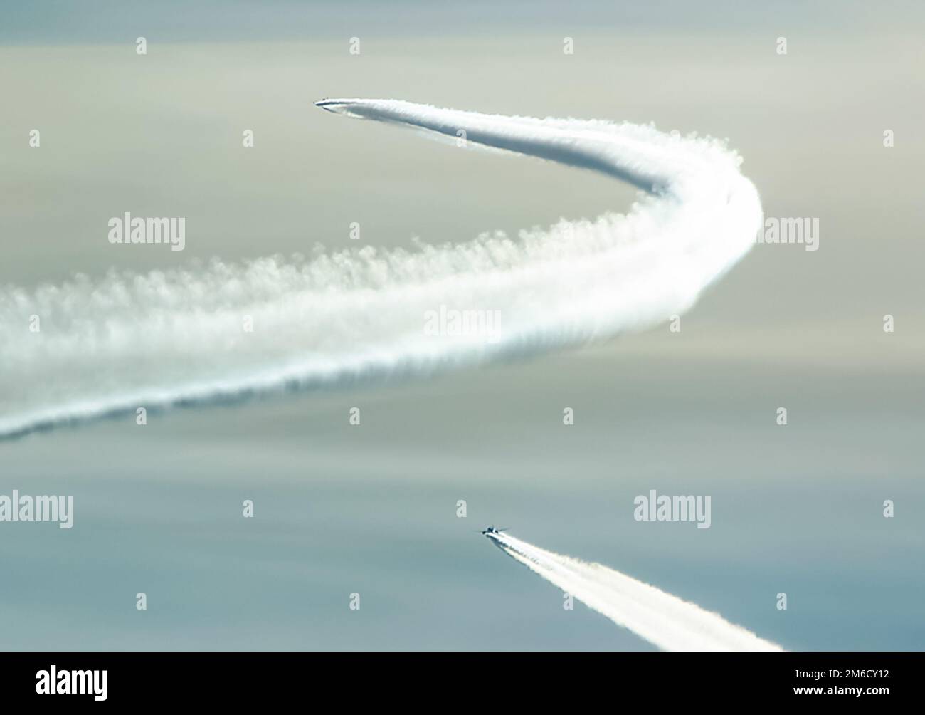 Condensation trail left by the aircraft during Stock Photo