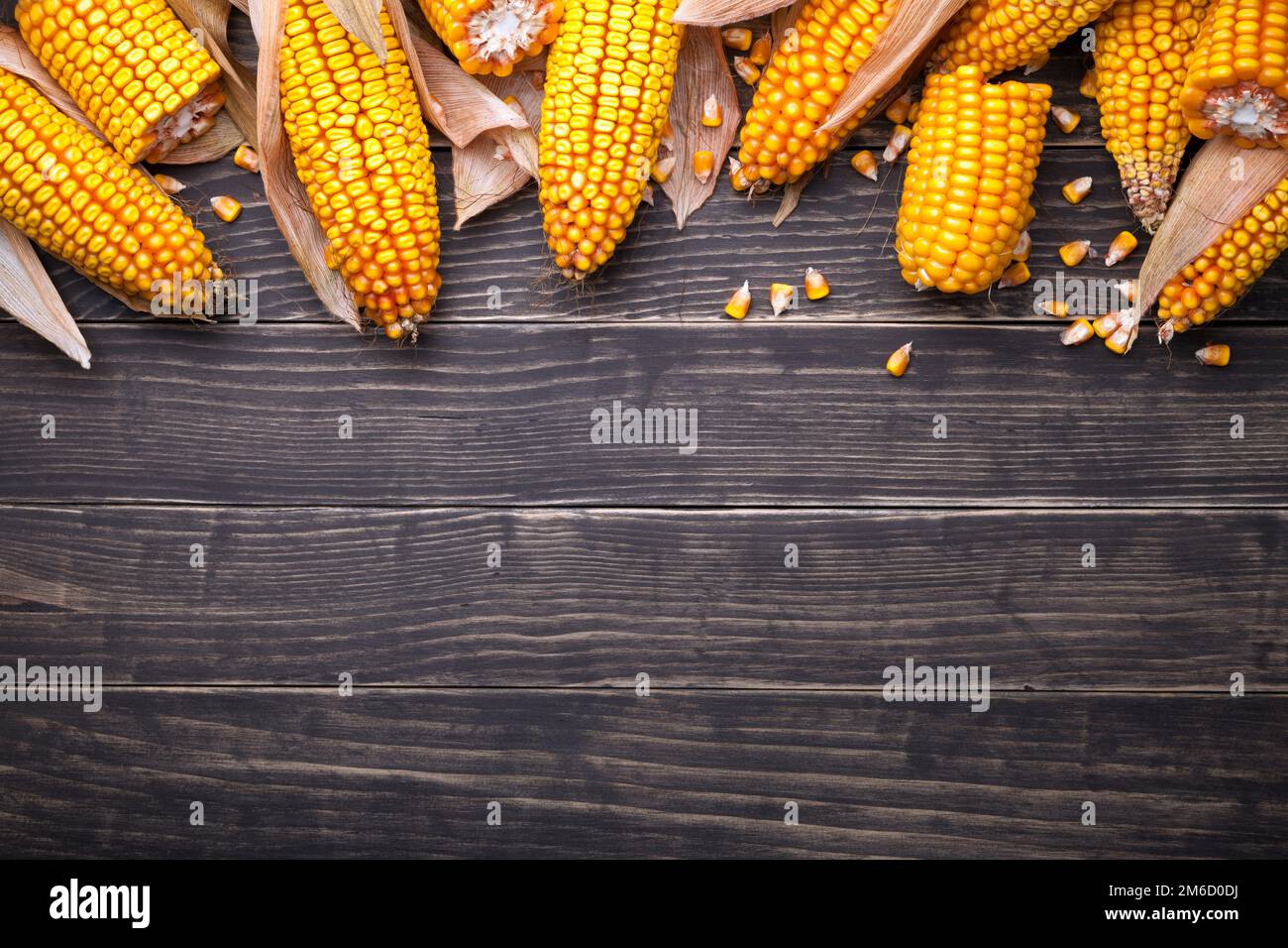 Corn Cobs On Wooden Table Stock Photo
