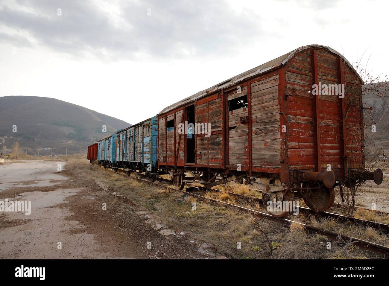 Abandoned old railway wagons at station, old train wagons in an abandoned station Stock Photo