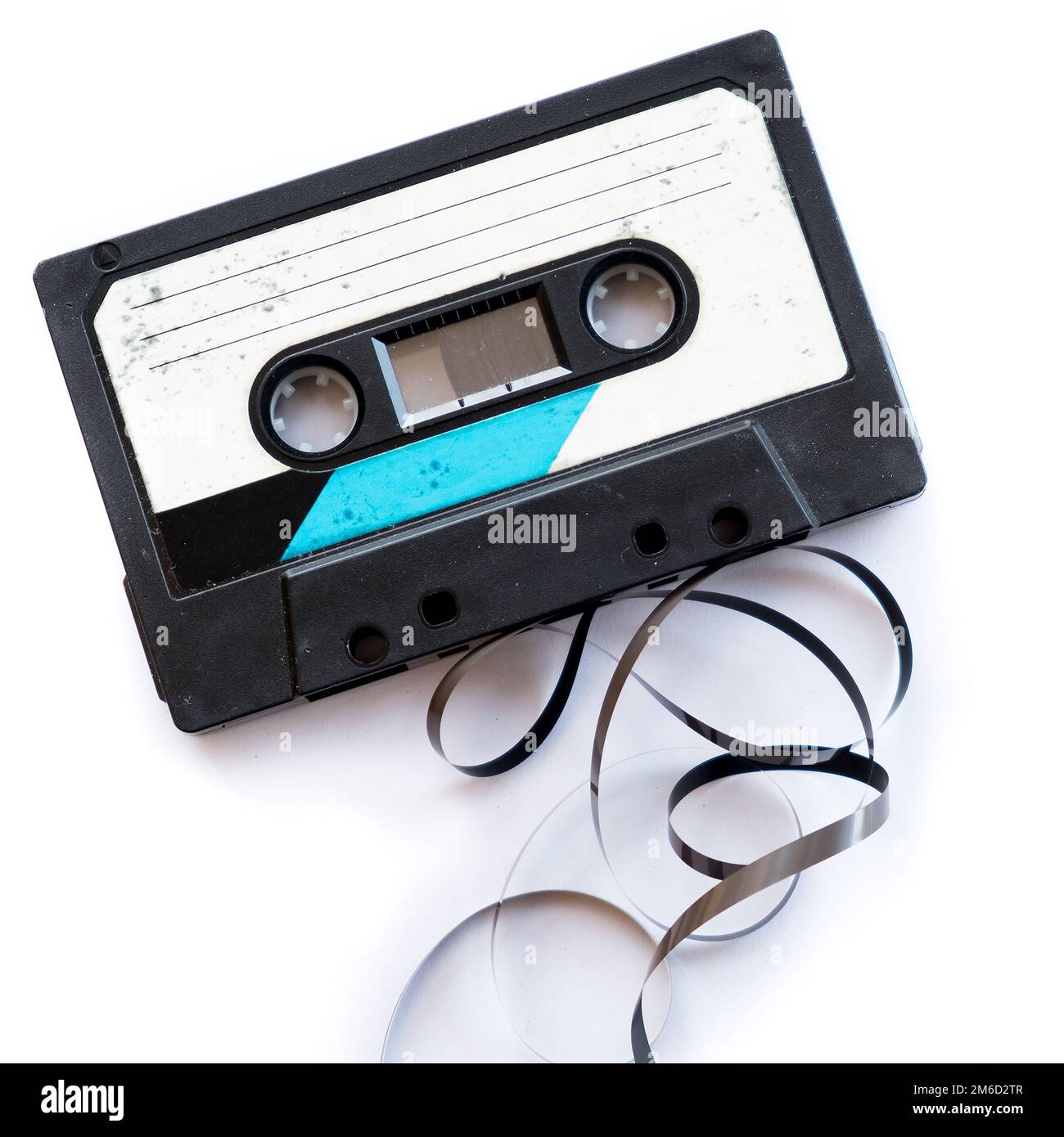 Audio tape blank label rolled out isolated white playlist Stock Photo